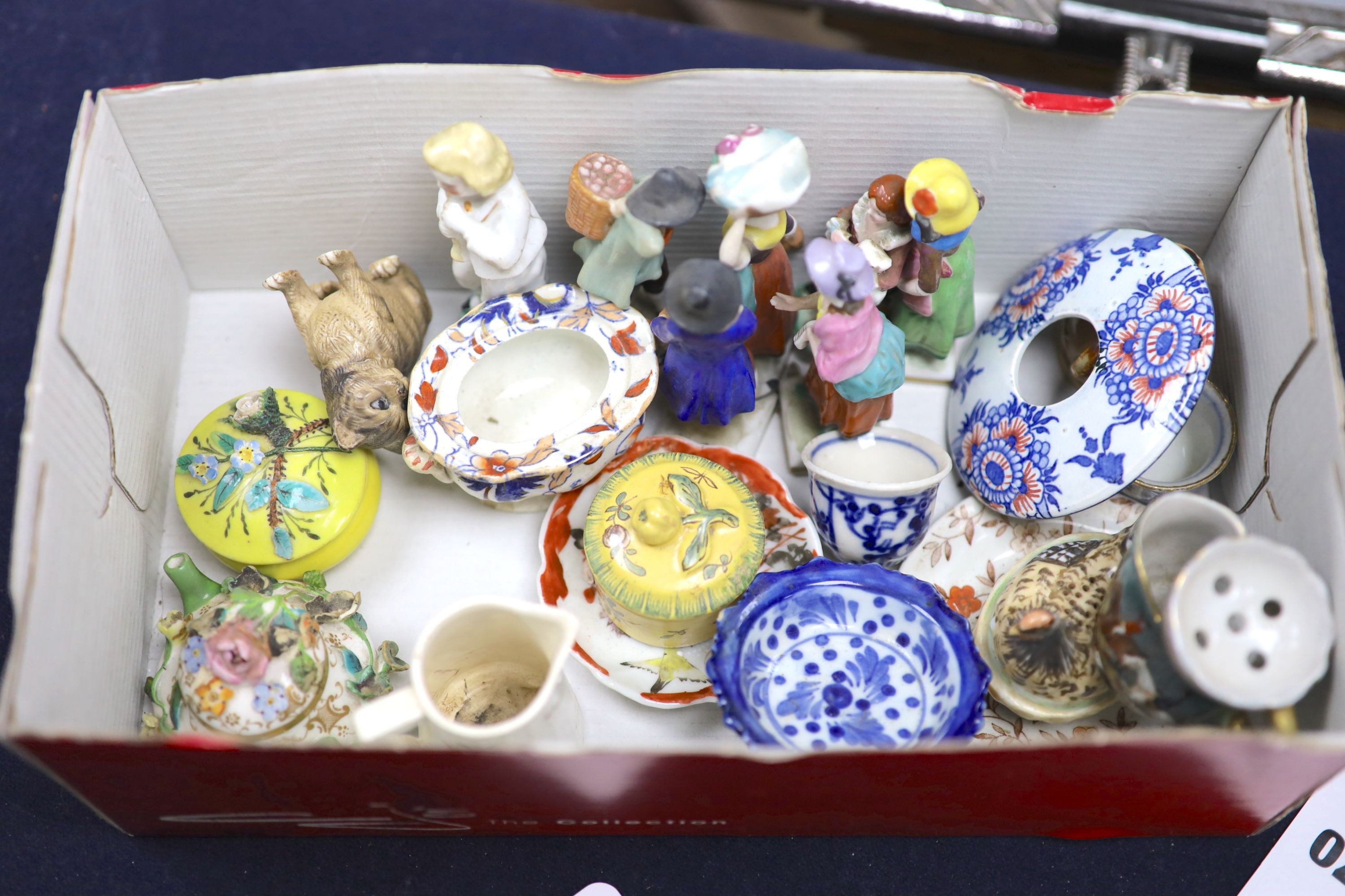 A quantity of miniature ceramic pots, figurines, animal ornaments etc